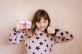 The little girl with a pink photo camera. Royalty Free Stock Photo