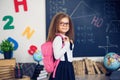 Girl with a school backpack. The concept of school, study, education, friendship, childhood. Royalty Free Stock Photo