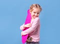 Little girl with pink skateboard Royalty Free Stock Photo