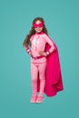 Little girl in pink superhero costume and mask Royalty Free Stock Photo