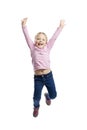 A little girl in a pink sweater and jeans joyfully jumps. Isolated over white background.