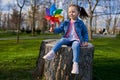 Little girl with a pinwheel in the park