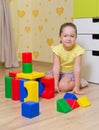Little girl with plastic cubes