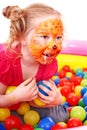 Little girl play colourful balls. Royalty Free Stock Photo