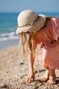 Little girl play with shells at beach Royalty Free Stock Photo