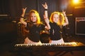 Little girl play on synthesizer in music studio Royalty Free Stock Photo