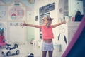 Little girl in playground. Caucasian girl playing in playroom. L