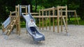 Little girl on a playground. Child playing outdoors in summer. Kids play on school yard. Royalty Free Stock Photo