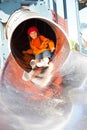 Little girl in playground tube Royalty Free Stock Photo