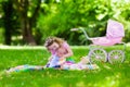 Little girl playing with baby brother