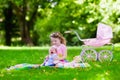 Little girl playing with baby brother