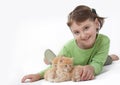 A little girl playing with baby cat