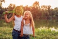 Little girl playing badminton with sister in summer park. Kids having fun outdoors. Close up of shuttlecock Royalty Free Stock Photo