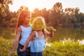 Little girl playing badminton with sister in summer park. Kids having fun outdoors. Close up of shuttlecock Royalty Free Stock Photo