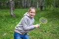 Little girl playing badminton on the street Royalty Free Stock Photo