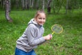 Little girl playing badminton on the street Royalty Free Stock Photo