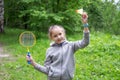 Little girl playing badminton on the street Royalty Free Stock Photo