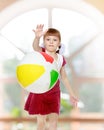 Little girl is playing with a ball. Royalty Free Stock Photo