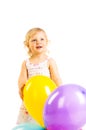 Little girl playing with balloons on a white background. Royalty Free Stock Photo