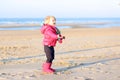 Little girl playing on the beach Royalty Free Stock Photo