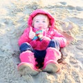 Little girl playing on the beach Royalty Free Stock Photo