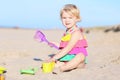 Little girl playing on the beach Royalty Free Stock Photo