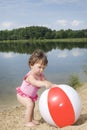 Little girl playing on the beach Royalty Free Stock Photo