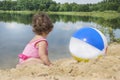 Little girl playing on the beach Royalty Free Stock Photo