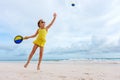 Little girl playing beach tennis Royalty Free Stock Photo