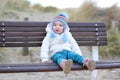 Little girl playing on the beach at winter Royalty Free Stock Photo