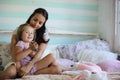 Little girl is playing with a big red cat in the country in Russia. Image with selective focus Royalty Free Stock Photo