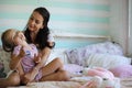 Little girl is playing with a big red cat in the country in Russia. Image with selective focus Royalty Free Stock Photo