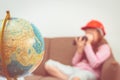 Girl playing with binocular and map Globe for travel conc