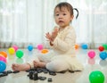 Little girl playing with black domino Royalty Free Stock Photo