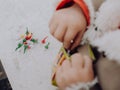 Little girl playing with bombs, colorful firecrackers