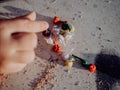 Little girl playing with bombs, colorful firecrackers