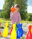 Little girl playing bowling Royalty Free Stock Photo