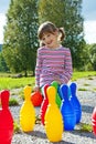 Little girl playing bowling Royalty Free Stock Photo