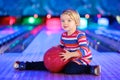 Little girl playing bowling Royalty Free Stock Photo