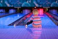 Little girl playing bowling Royalty Free Stock Photo