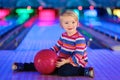 Little girl playing bowling Royalty Free Stock Photo