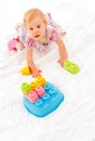 Little girl playing with building blocks