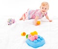 Little girl playing with building blocks