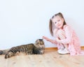 Little girl playing with cat at home Royalty Free Stock Photo