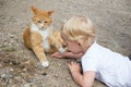 Little girl playing cat Royalty Free Stock Photo