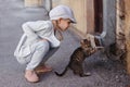 Little girl playing with a cat Royalty Free Stock Photo