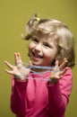 Little girl playing cats cradle game Royalty Free Stock Photo