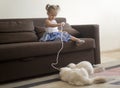 Little girl playing with cats Royalty Free Stock Photo