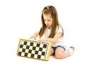 Little girl playing chess. Isolated on white background. Royalty Free Stock Photo