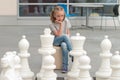 Little girl playing chess game. Royalty Free Stock Photo